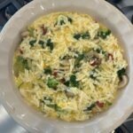 layer with eggs over vegetables